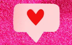 Pink social share symbol with a heart.